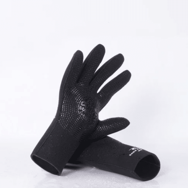 The Ripcurl Dawn Patrol 3mm Surf Gloves in black are displayed on a white surface, with one glove standing upright and the other lying flat beneath it.