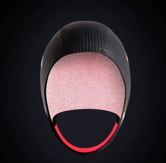 The C-Skins Swim Research 3mm GBS Cap features a black, textured top with an open face, soft light pink lining, and thin red-edged trim. Its sleek aerodynamic design stands out against a dark gradient background.