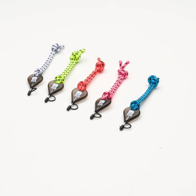 Five Bulldog Fin Key & Leash Strings in white, yellow, orange, pink, and blue with knotted cords and metal clips are lined up on a white background. Each features a small black label.