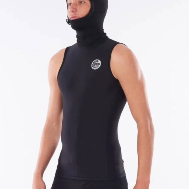 A person wearing the Ripcurl Flashbomb Polypro Hooded Vest, a sleeveless black wetsuit top with an attached hood and a circular chest logo, stands against a plain white background.