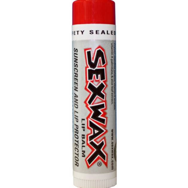 A tube of Sex Wax Lip Balm SPF30 with a red cap, labelled as “sunscreen and lip protector.” The label also mentions the product is safety sealed.